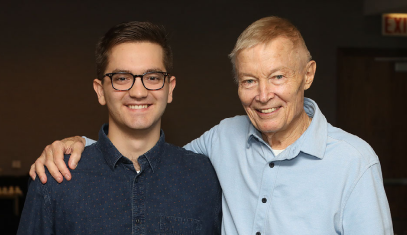 Male buddy and mentor pose for a photo